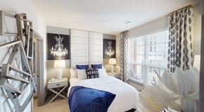 Brookfield apartment for rent - Fully furnished bedroom with a large window facing the private balcony. 