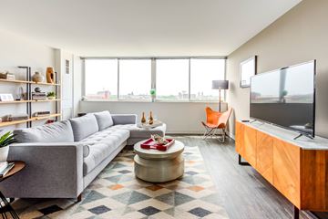 Chicago apartment for rent - a living room with a couch and a tv