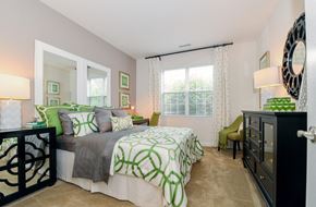 Wauwatosa apartment for rent - a bedroom with a bed and a dresser and a window