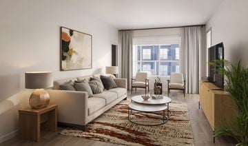 Milwaukee apartment for rent - A living room with a couch, a coffee table, and a painting on the wall.