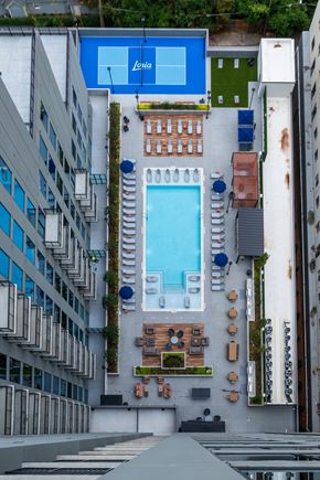 Atlanta apartment for rent - A Leida pool is surrounded by buildings.