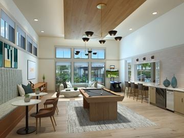Davenport apartment for rent - A modern living room with a pool table and a kitchen area.