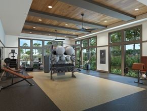 Davenport apartment for rent - A gym with a variety of equipment including a bench press, a squat rack, and a rowing machine.