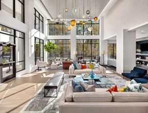 Johns Creek apartment for rent - A modern living room with a large sectional sofa and a coffee table.