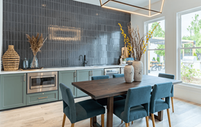 Cartersville apartment for rent - a dining room with a wooden table and blue chairs