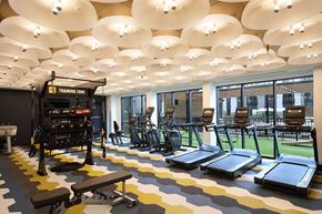 Vernon Hills apartment for rent - a gym with a variety of exercise equipment in the lobby of a building