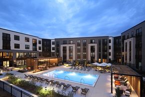 Vernon Hills apartment for rent - a rendering of a pool in front of an apartment building