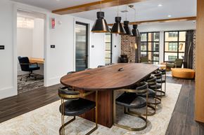 Doraville apartment for rent - a dining room with a large wooden table and chairs
