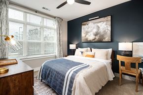 Doraville apartment for rent - a bedroom with a bed and a large window