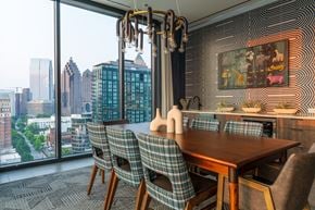 Atlanta apartment for rent - A dining room with a view of the cityscape.