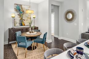 Johns Creek apartment for rent - A dining room with a round table surrounded by chairs.
