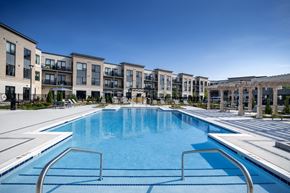 Aurora apartment for rent - a large swimming pool with apartment buildings in the background