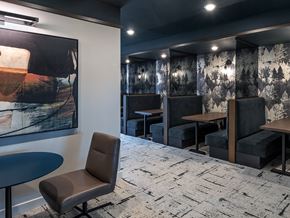 Aurora apartment for rent - a dining room with tables and chairs and a painting on the wall