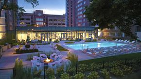 Chicago apartment for rent - Fenced-in pool area with lots of seating options at nighttime.