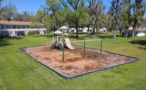 Green Cove Springs apartment for rent - a playground with a swing set in a park