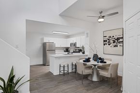 Las Vegas apartment for rent - Dining room and kitchen with ceiling fan and breakfast bar.