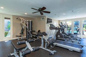 La Mesa apartment for rent - Community fitness center with ceiling fan and weight and cardio machines.