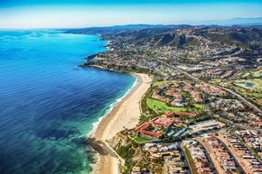 Laguna Niguel apartment for rent - A coastal city with a beach and a mountain in the background.