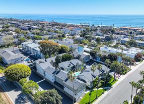 Carlsbad apartment for rent - an aerial view of a neighborhood with houses and the ocean in the background