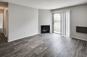 El Cajon apartment for rent - Apartment living room with fireplace and sliding glass door to balcony or patio.
