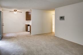 La Mesa apartment for rent - Carpeted apartment living room with view to dining room and kitchen.