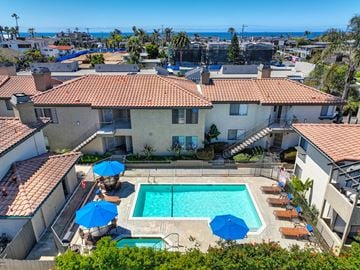 Carlsbad apartment for rent - an aerial view of a swimming pool in the backyard of a house