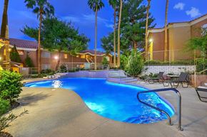 Henderson apartment for rent - Beautiful community swimming pool at dusk with hot tub in background.