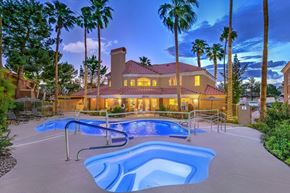 Henderson apartment for rent - Beautiful blue hot tub and pool with community clubhouse in background.