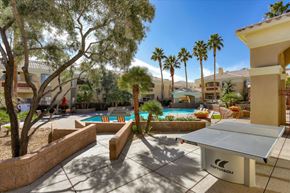 Las Vegas apartment for rent - Pool area and ping pong table with palm trees and beautiful blue sky.