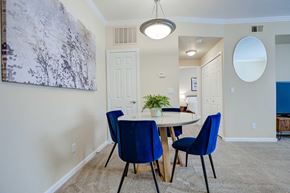 Denver apartment for rent - A dining room with a table and chairs.