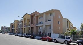 San Diego townhouse for rent - Street view of tan and yellow building exterior.