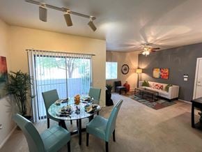 Phoenix apartment for rent - A dining room with a glass table and chairs.