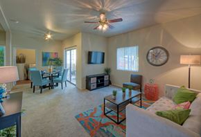 Phoenix apartment for rent - A living room with a couch, chairs, and a ceiling fan.