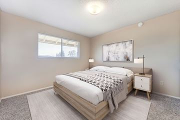 Modesto apartment for rent - A bedroom with a large bed and a window.