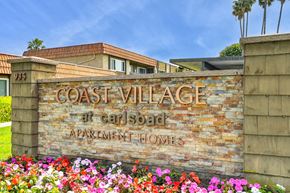 Carlsbad apartment for rent - a sign for the coast village at cali soar apartments