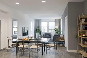 Sacramento apartment for rent - A modern dining room with a glass table and chairs.