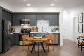 Sacramento apartment for rent - A kitchen with a table and chairs in the middle of it.