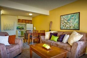 Kerman apartment for rent - A living room with a couch, chairs, and a painting on the wall.