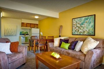 Kerman apartment for rent - A living room with a couch, chairs, and a painting on the wall.