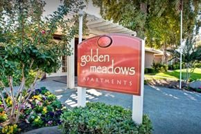 Kerman apartment for rent - A sign for Golden Meadows Apartments.