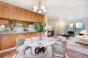 Modesto apartment for rent - A dining room with a white table and chairs.