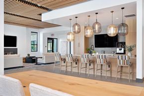 Reno apartment for rent - A modern kitchen with a dining table and chairs.