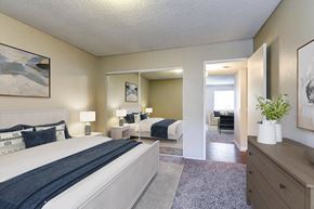 Santee apartment for rent - A bedroom with a large bed and a mirror.