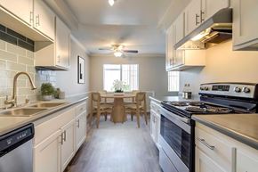 Santee apartment for rent - A modern kitchen with a dining table and chairs.