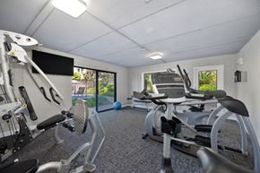 Carlsbad apartment for rent - the gym has plenty of exercise equipment and a tv