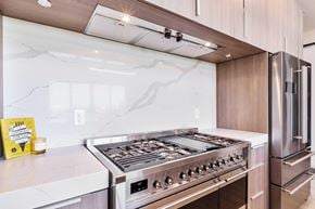 Sacramento apartment for rent - The stainless steel oven and fridge in the kitchen.