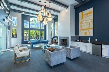 Oceanside apartment for rent - a large living room with blue walls and a pool table