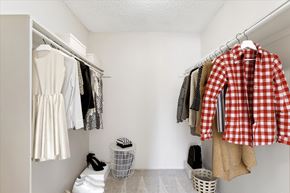 Colorado Springs apartment for rent - A red and white checkered shirt hanging on a clothes rack.