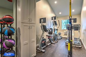 San Diego apartment for rent - A gym with exercise equipment and a row of exercise balls on the wall.