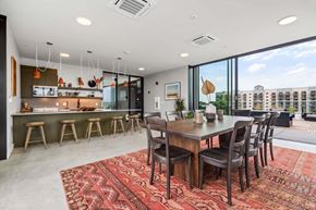 National City apartment for rent - A modern dining room with a large table and chairs.